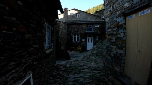 DOLLY SHOT - The picturesque little schist village of Piod&atilde;o clings to a steeply terraced mountainside deep within the foothills of the Serra de A&ccedil;or range in central Portugal. Schist stairs.