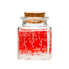 liquid in a glass jar, bubbles on glass with a red background
