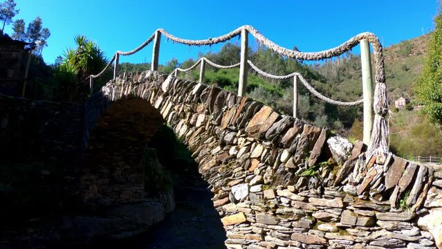 PAN SLOW MOTION SHOT - A schist bridge at Foz D'&Eacute;gua, Arganil, Coimbra, Portugal.