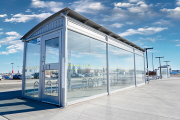 A public transit bus shelter at a municipal transfer station for urban commuters in Airdrie Alberta Canada.