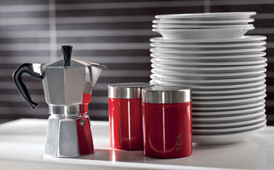 Modern kitchen dishes, coffee maker, seamless red, luxurious interior background.