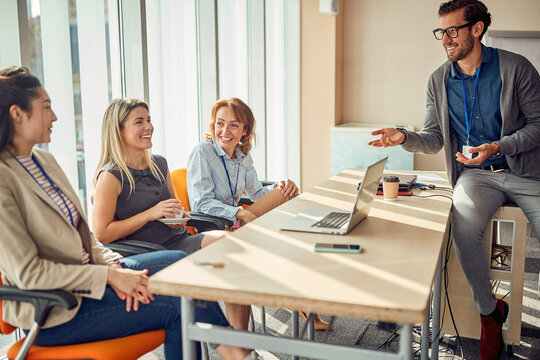 Group of multiethnic colleagues chatiing on a break