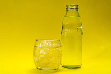Glass beaker and bottle filled with ice and purified water.
