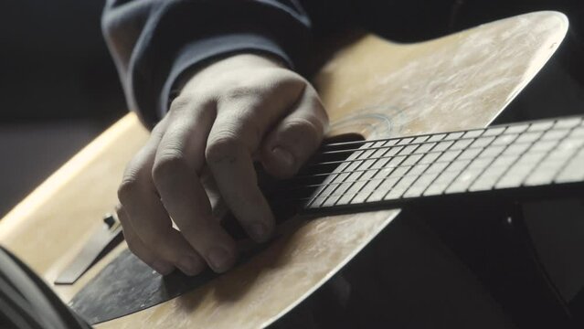 Playing acustic Guitar closeup.People and musical education concept.