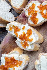natural red salmon caviar with baguette and butter