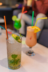 Amazing cocktails on the white table, close up