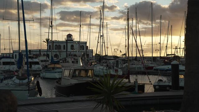 Boats and Marina Rubicon Shopping Center at sunset, Playa Blanca, Lanzarote, Canary Islands, Spain