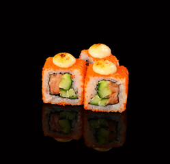 rolls on a black background with reflection