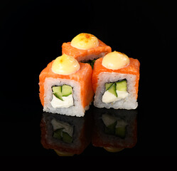 rolls on a black background with reflection