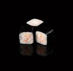 rolls on a black background with reflection