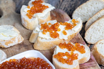 natural red salmon caviar with baguette and butter