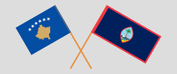 Crossed flags of Kosovo and Guam. Official colors. Correct proportion