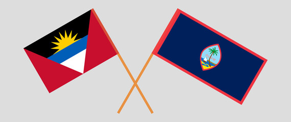 Crossed flags of Antigua and Barbuda and Guam. Official colors. Correct proportion