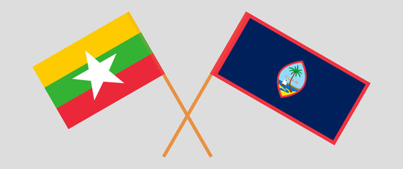 Crossed flags of Myanmar and Guam. Official colors. Correct proportion