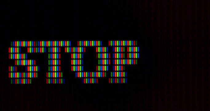 The word stop is written in pixel letters on the monitor. RGB font rendering. Dark background. The cursor is blinking.