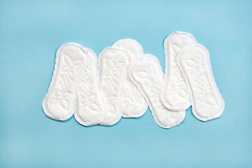 Sanitary napkin on blue background