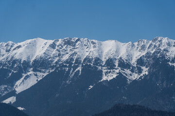 Fototapeta na wymiar snow covered mountains, Piatra Craiului Mountains, viewpoint from Magura Branului Mountains, Romania 