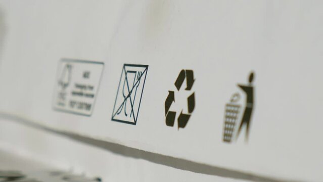 Recycling bag Closeup view of pap sign and other eco-label on Brown paper bag that is 100 recyclable and reusable spbd. Symbol indicates paper and cardboard. Concept: ecology Special mark on product 