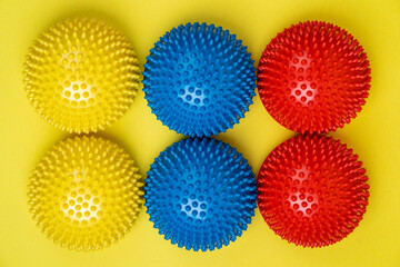 colored balancers on a light yellow background, treatment and prevention of flat feet, hallux valgus