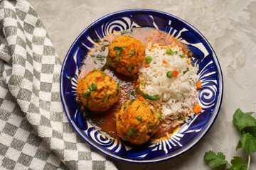 Meatballs with chipotle red sauce and rice. Mexican food