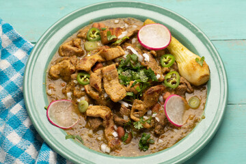 Meat in its juice is a stew with green sauce and steak. Mexican food