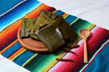 Oaxacan Chicken Tamal Wrapped in a Green Banana Leaf. © Fabián Montaño