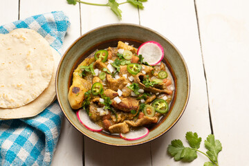 Meat in its juice is a stew with green sauce and steak. Mexican food