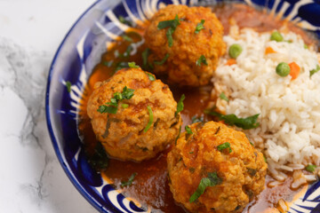 Meatballs with chipotle red sauce and rice. Mexican food