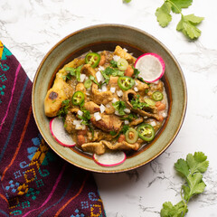 Meat in its juice is a stew with green sauce and steak. Mexican food