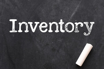 Inventory word on a black chalk board.