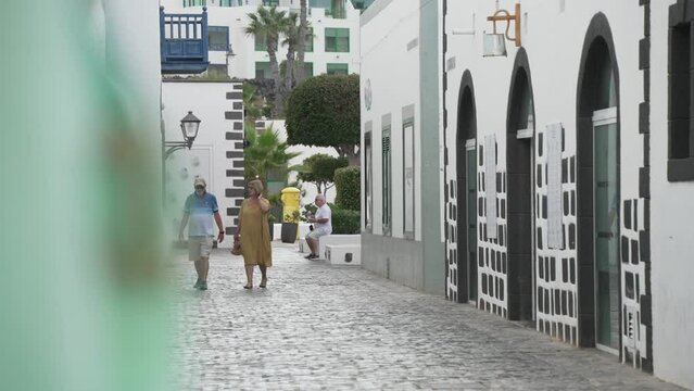 Shoppers and garment in Rubicon Marina, Playa Blanca, Lanzarote, Canary Islands, Spain