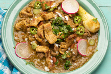 Meat in its juice is a stew with green sauce and steak. Mexican food