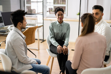 Young Multiracial Millennial Friends Sitting