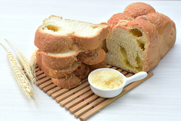 Big bread with cheese, grated parmesa cheese on white wooden background