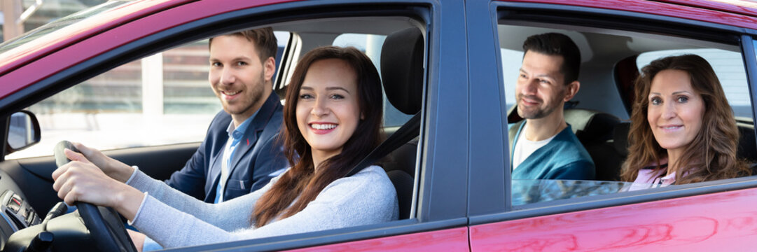 Smiling People Sitting In Car