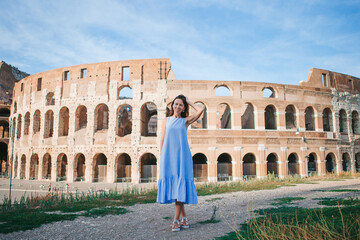 Young woman in front of Colosseum in Rome, Italy. Girl in Europe vacation