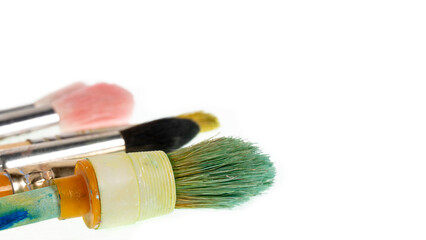 Fototapeta premium brushes smeared in paints. paint brushes artist tools. brush on white background
