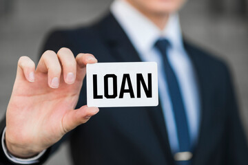 Man showing paper with LOAN text