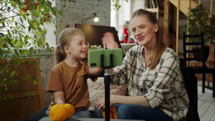 Mom and daughter are knitting in front of the camera. They end the stream and say goodbye