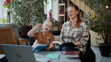 Mom and girl are engaged with a tutor via the Internet. They turn on the laptop and greet the teacher