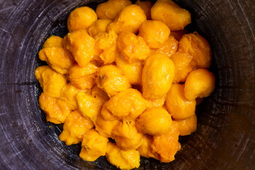 Top view of peeled mangoes in a plastic pan prepared to cook traditional syrup for Holy Week in Nicaragua
