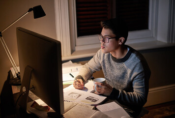 Determined to get it done. Cropped shot of a young student studying late into the night.
