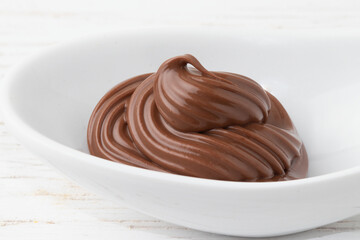 Delicious hazelnut in a white bowl.