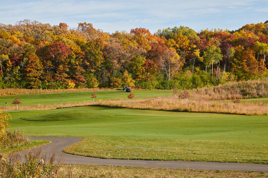 Golf course with trees turning many colors during fall near Minneapolis Minnesota USA