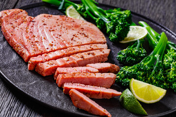fried tuna steak with boiled broccolini and lime