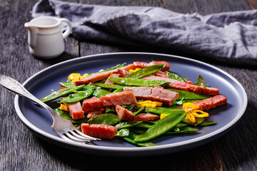 fried sugar snap peas with tuna slices