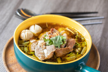 Braised pork kaolao with morning glory and sprouts, local Thai food