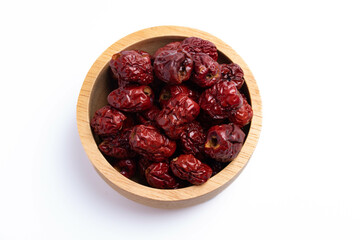 Dried Chinese jujube in a cup on white background. Isolated image.