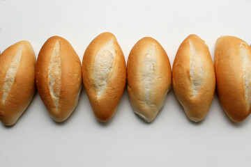 Delicious, fresh, fluffy, crunchy, hot, freshly made bun mexican bread, french bread, white, loaf baked with wheat flour on white background ready to eat
