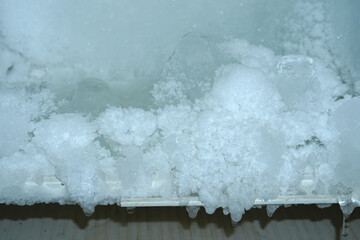The ice sticks together in the refrigerator compartment.    